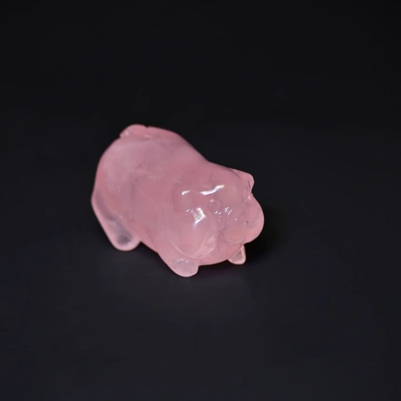 Whimsical pink crystal pig figurine enhancing positive energy in any space.
