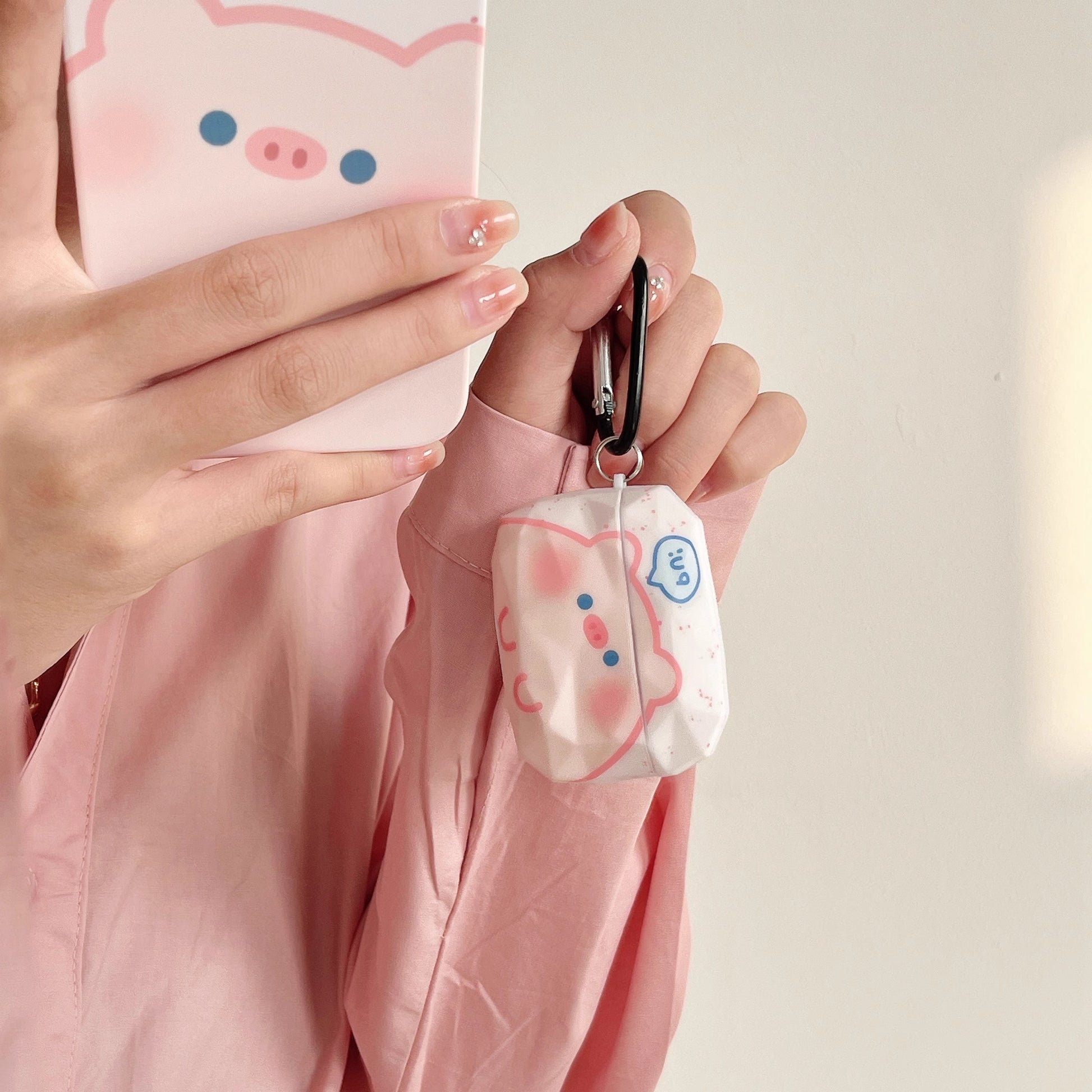 Front view of cute pink pig earphone case for Apple earbuds.