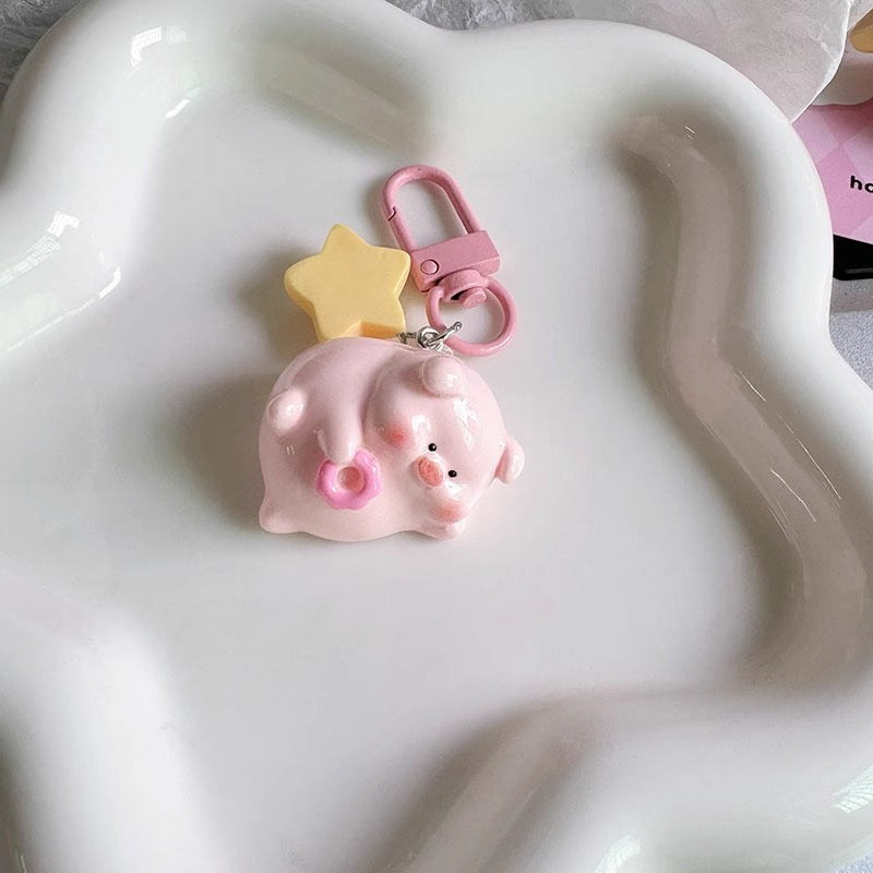 Chunky cartoon pig keychain as a fun and playful bag charm for purses and backpacks