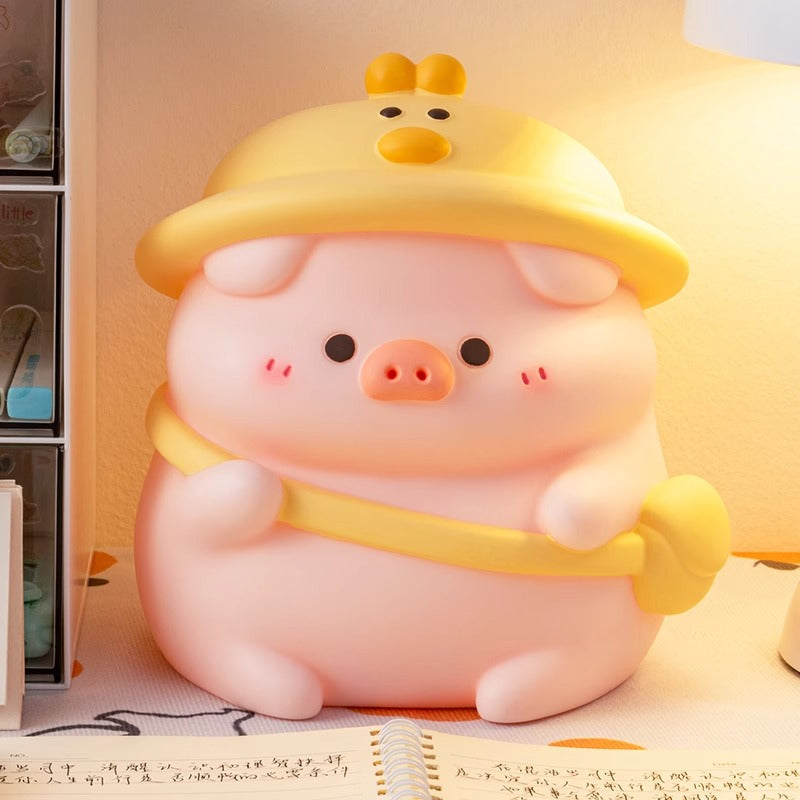 Adorable piggy bank featuring a playful duck hat design, perfect for kids' rooms.