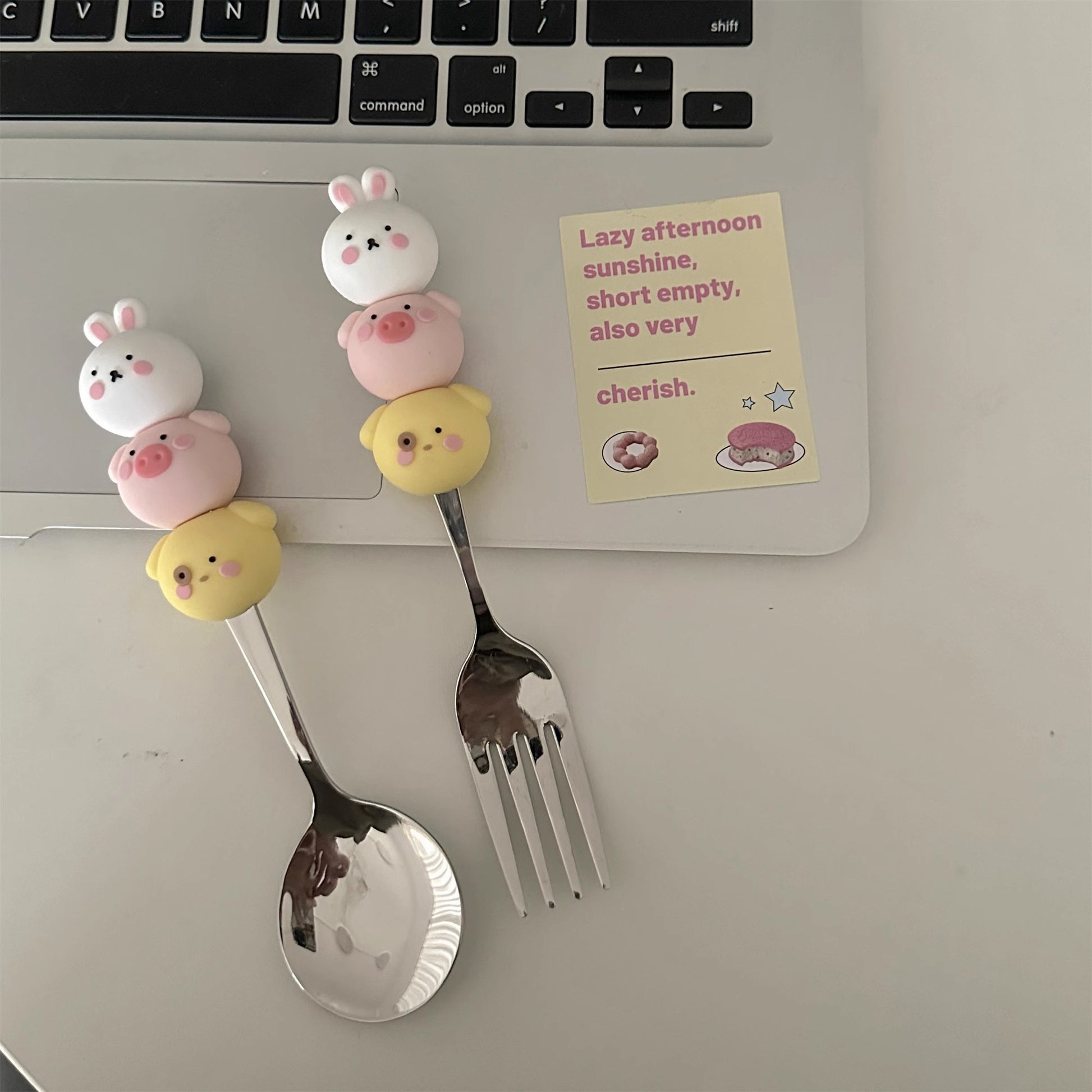  Happy family dining scene with children joyfully using the silicone cartoon pig utensils, enhancing mealtime fun.