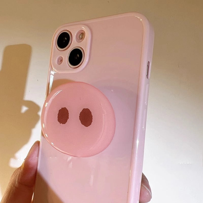 Durable pink phone case featuring a pig snout stand for hands-free use