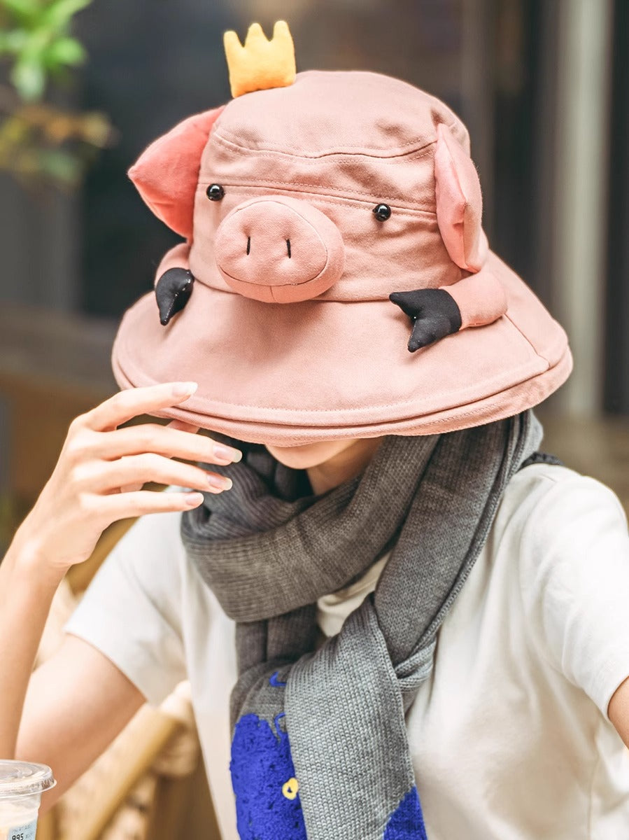 Handcrafted cute cartoon pig bucket hat for sun protection, outdoor fun.