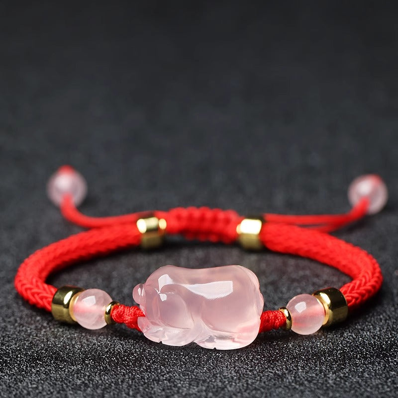 Close-up of the Lucky Pink Crystal Pig Bracelet, highlighting the high-quality pink crystals and whimsical pig-shaped charm, perfect for metaphysical jewelry