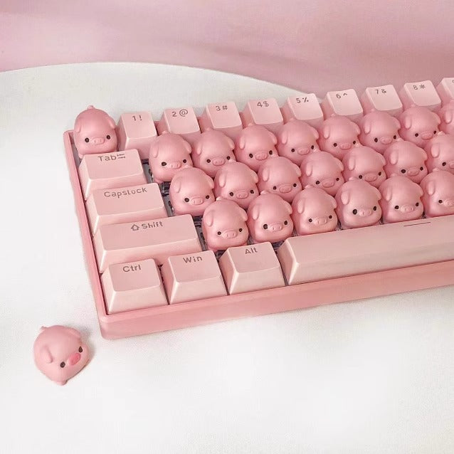 Cartoon pig keycap keyboard with custom backlighting, ergonomic design for gaming.