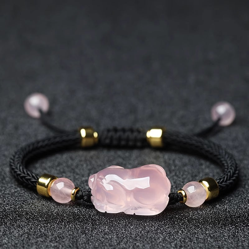 Lucky Pink Crystal Pig Bracelet worn on a wrist, illustrating its stylish and charming design, symbolizing joy, love, and abundance for everyday wear.