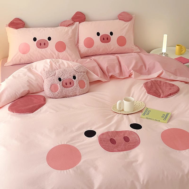 Cartoon Pig Cotton Bedding Set: A charming bedding set featuring playful cartoon pig designs, ideal for adding whimsy and comfort to children's and adult bedrooms alike.