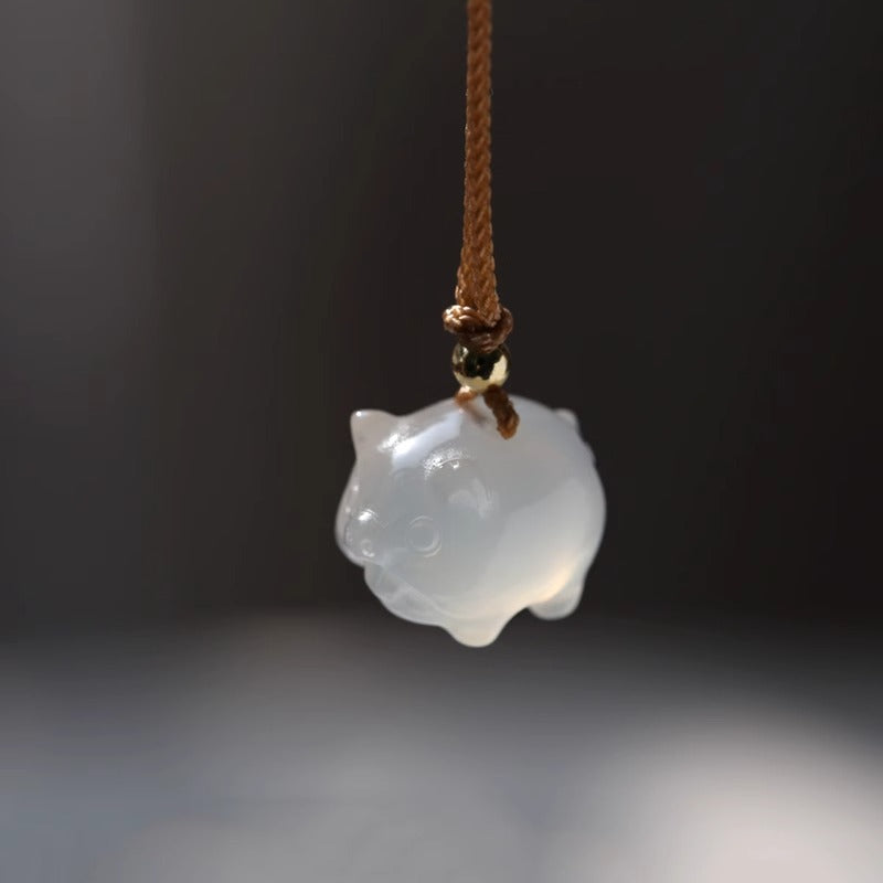 Close-up of White Chalcedony Pig Pendant | Unique Metaphysical Jewelry